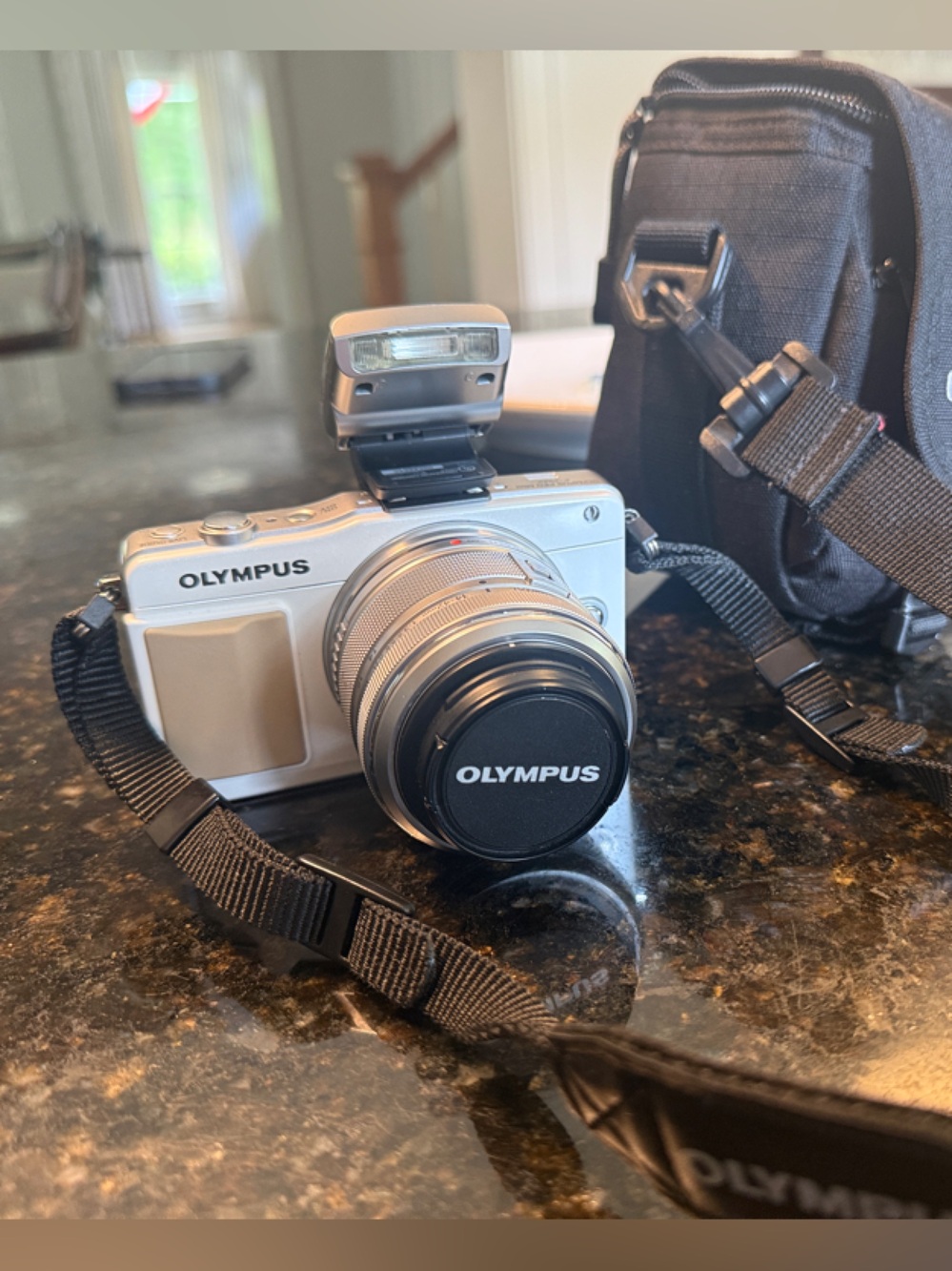 Olympus white Pen 2 Mirrorless Camera with Black Strap and Case